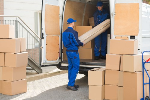Removal team planning a move in a Kew residential street