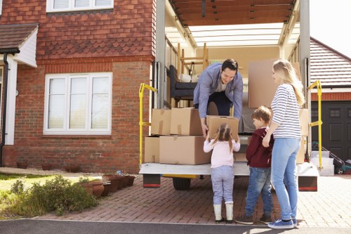 Packed moving boxes and furniture prepared for removals in Kew
