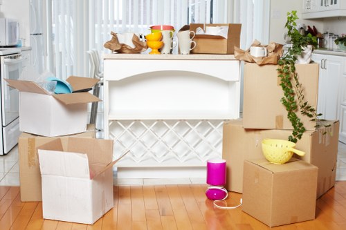 Local moving team handling boxes and furniture in Kew